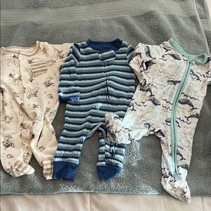 Newborn Bambi, striped and whale footie pajamas.